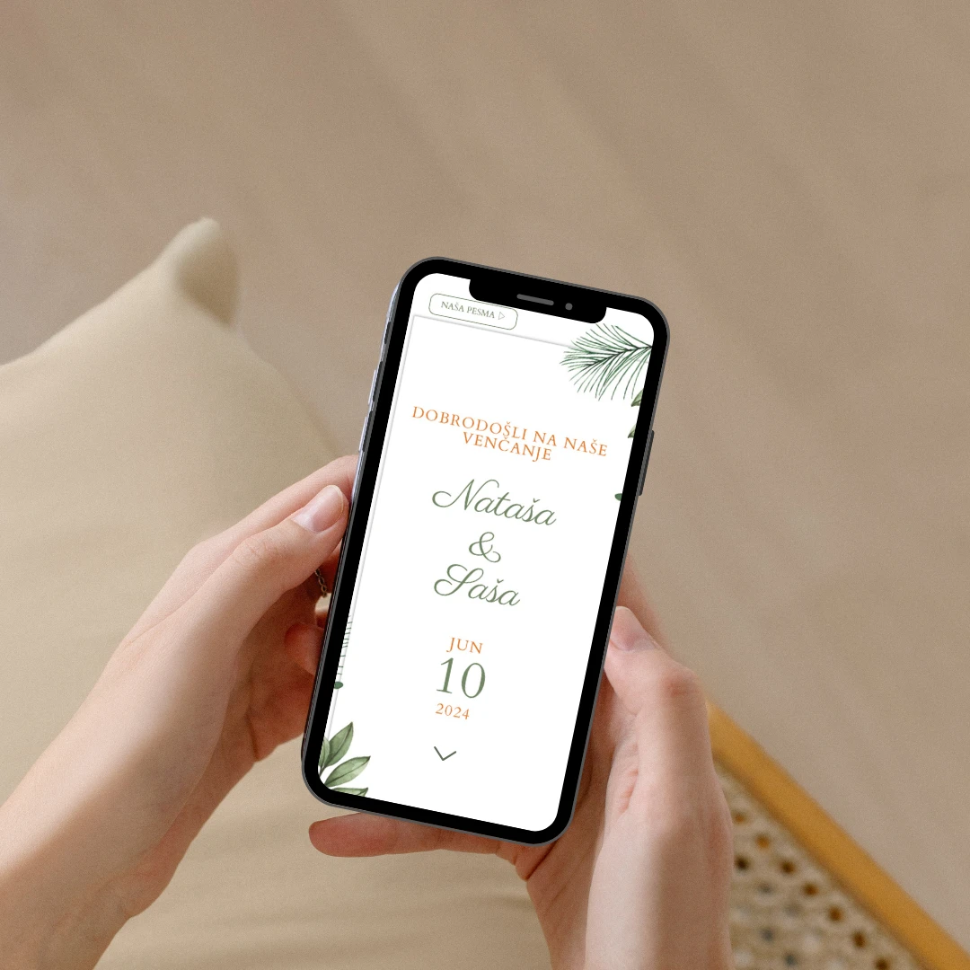 Onlajn pozivnica za venčanje sa cvetovima i elegantnim slovima prikazana na ekranu telefona